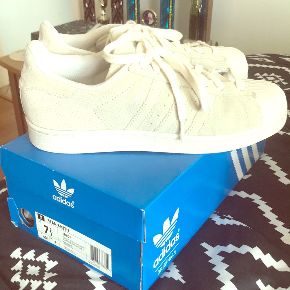 White suede Stan Smith adidas sneakers.